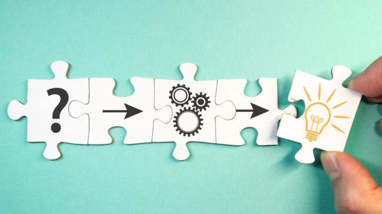 finding solution for a problem concept with jigsaw puzzle pieces