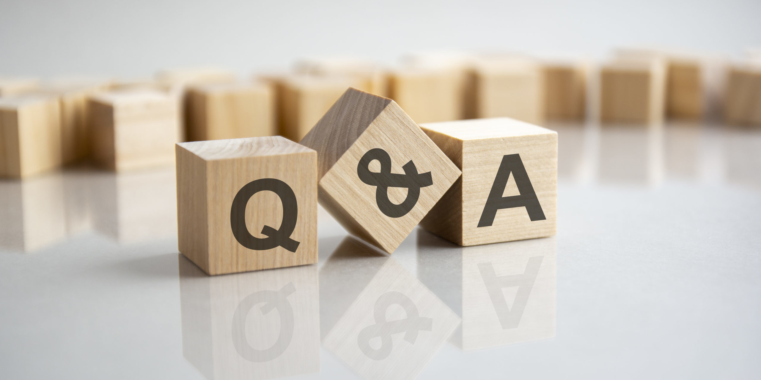 Q and A – question and answer shot form on wooden block