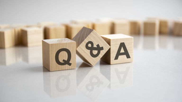 Q and A – question and answer shot form on wooden block