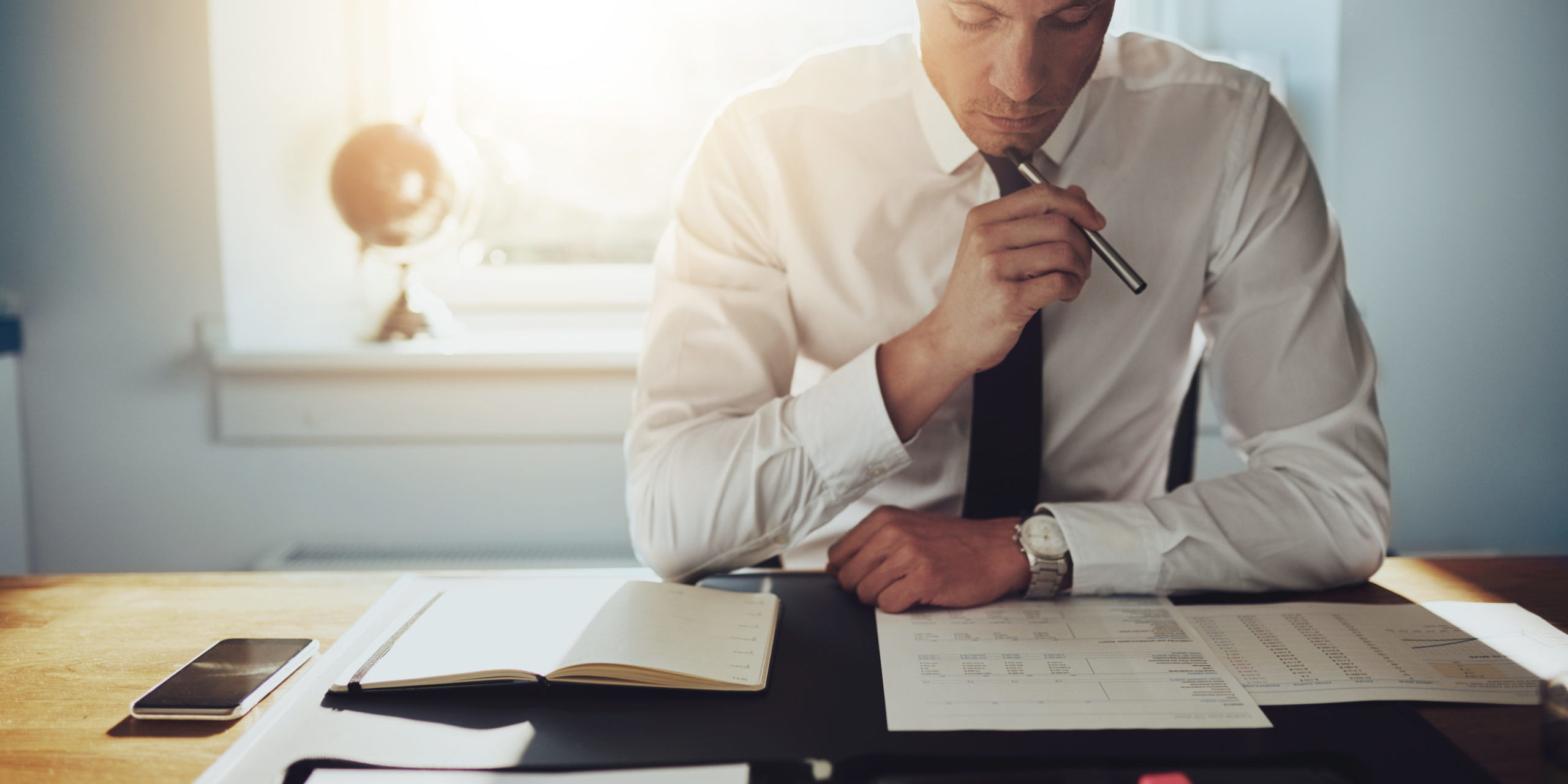 Serious business man working on documents