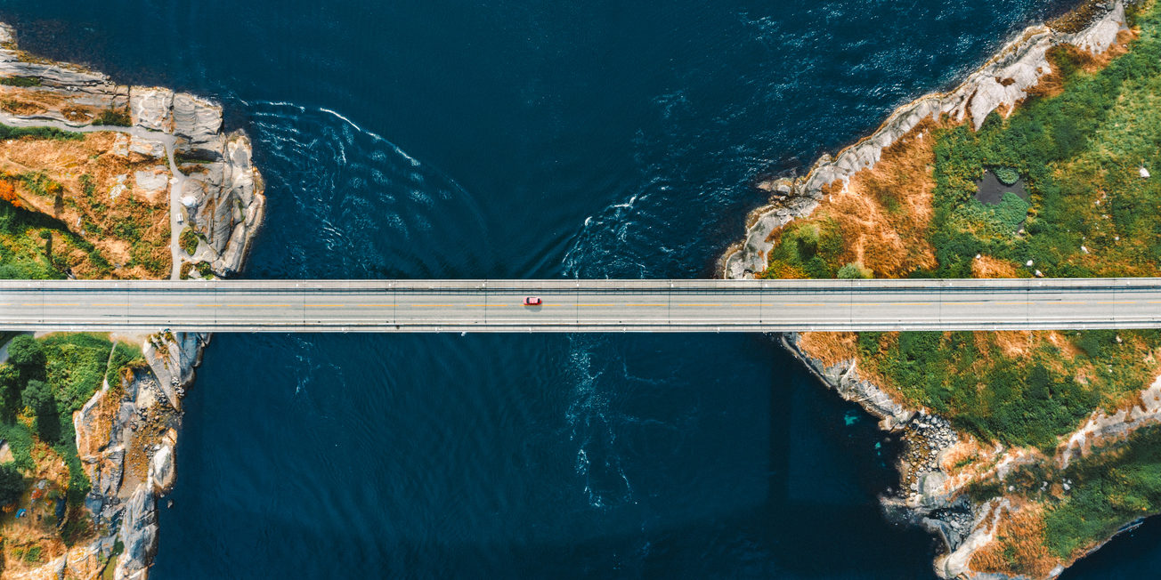 Aerial view Saltstraumen bridge in Norway road above sea connecting islands top down scenery transportation infrastructure famous landmarks scandinavian landscape