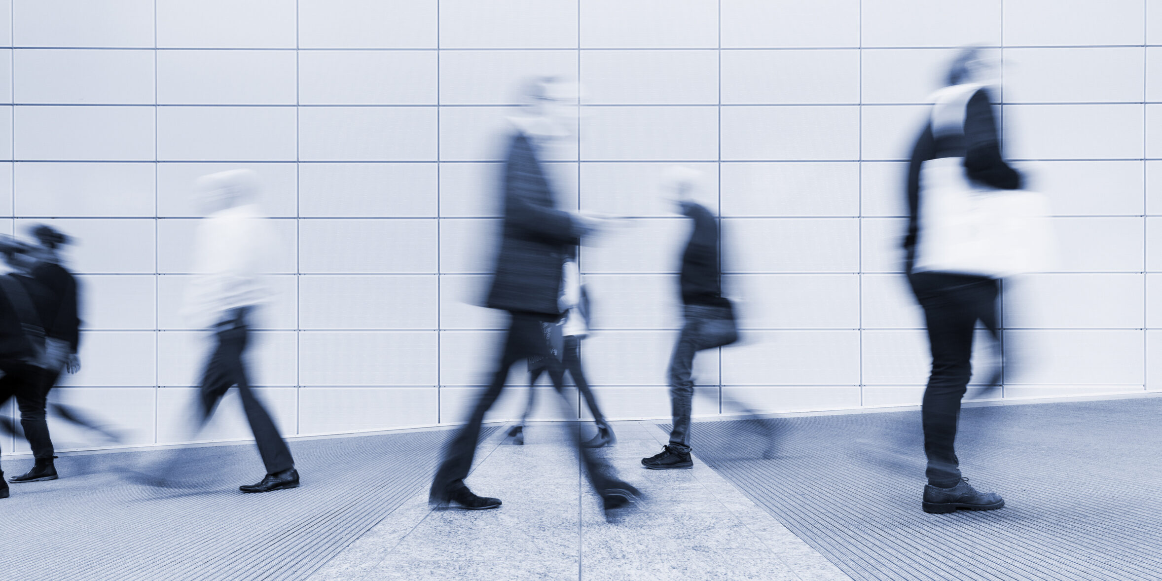 blurred people in a corridor