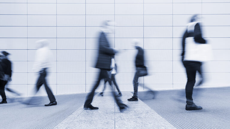 blurred people in a corridor